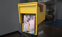 Adoorn Locking Post Mount Mailbox in Curb Yellow, the mailbox featured in Magnolia Journal's Summer 2026 'Life In Color' article.