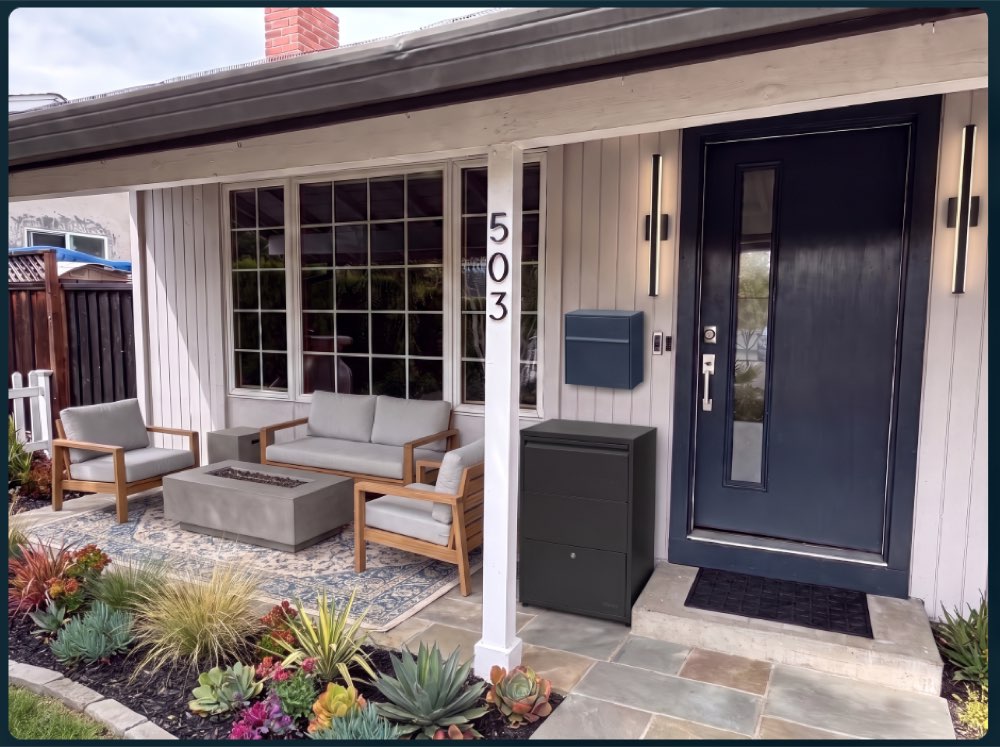 Modern Standard entry design with navy mailbox and wood seating