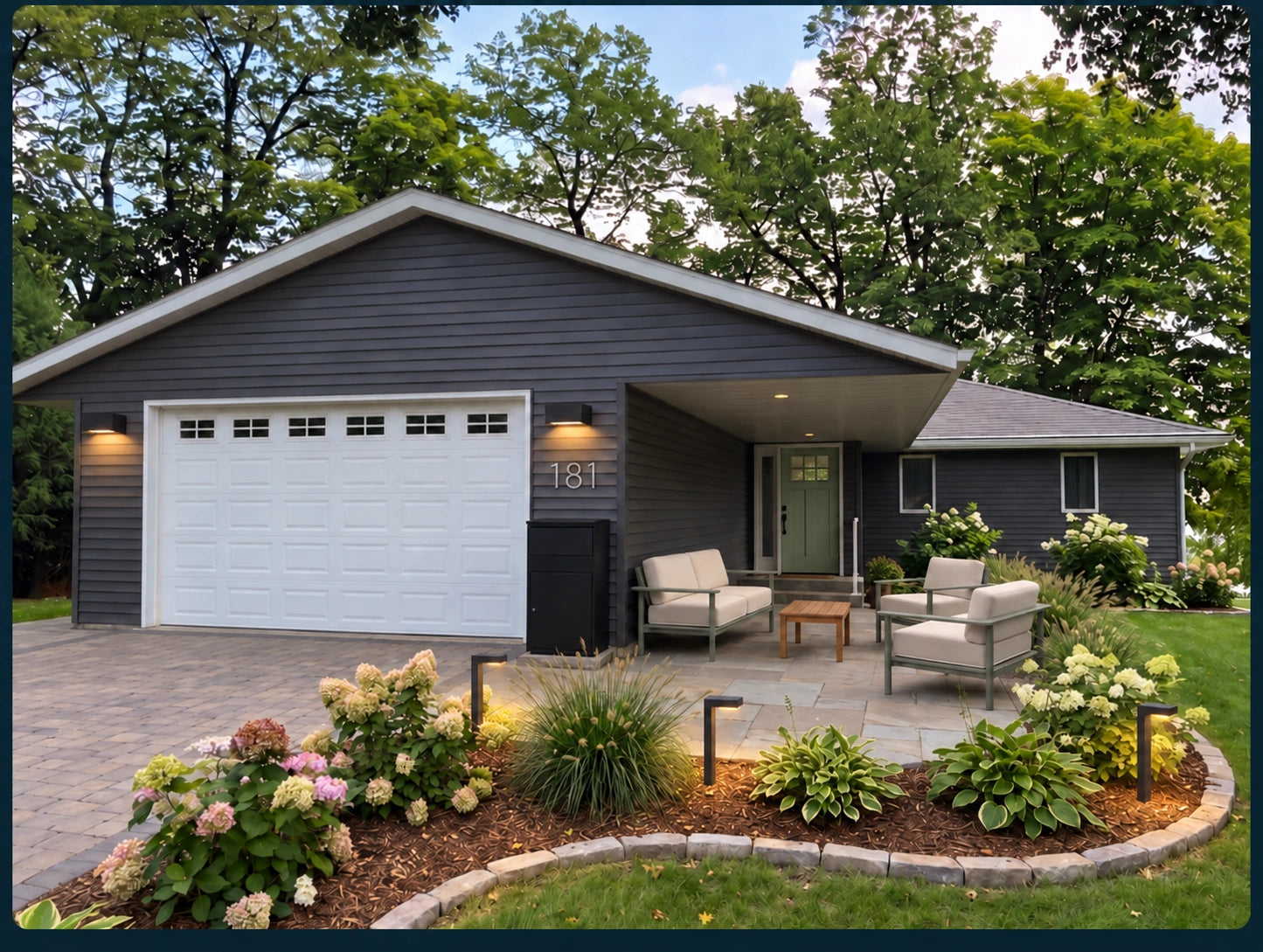 Editor’s Lakeview Front Door Edit Makeover with charcoal siding, a sage door, Silver house numbers, a Black package box, seating, and layered planting.
