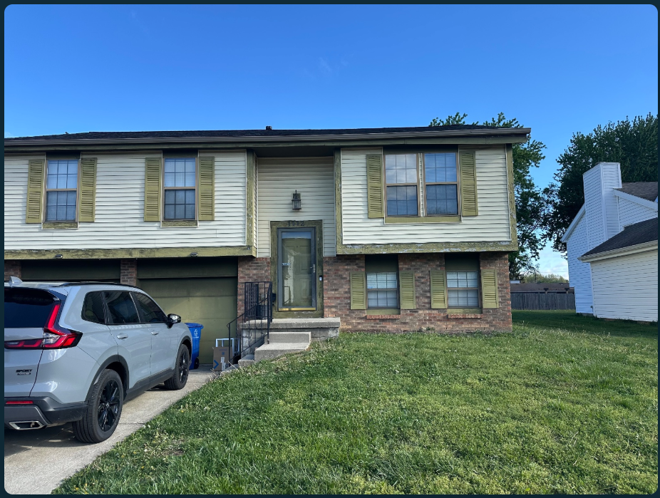 Before: a raised brick and cream-sided home with green shutters, a weathered front entry and lawn along the concrete steps.